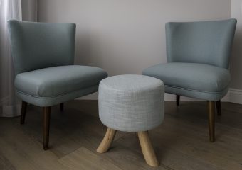Upholstered chairs and ottoman